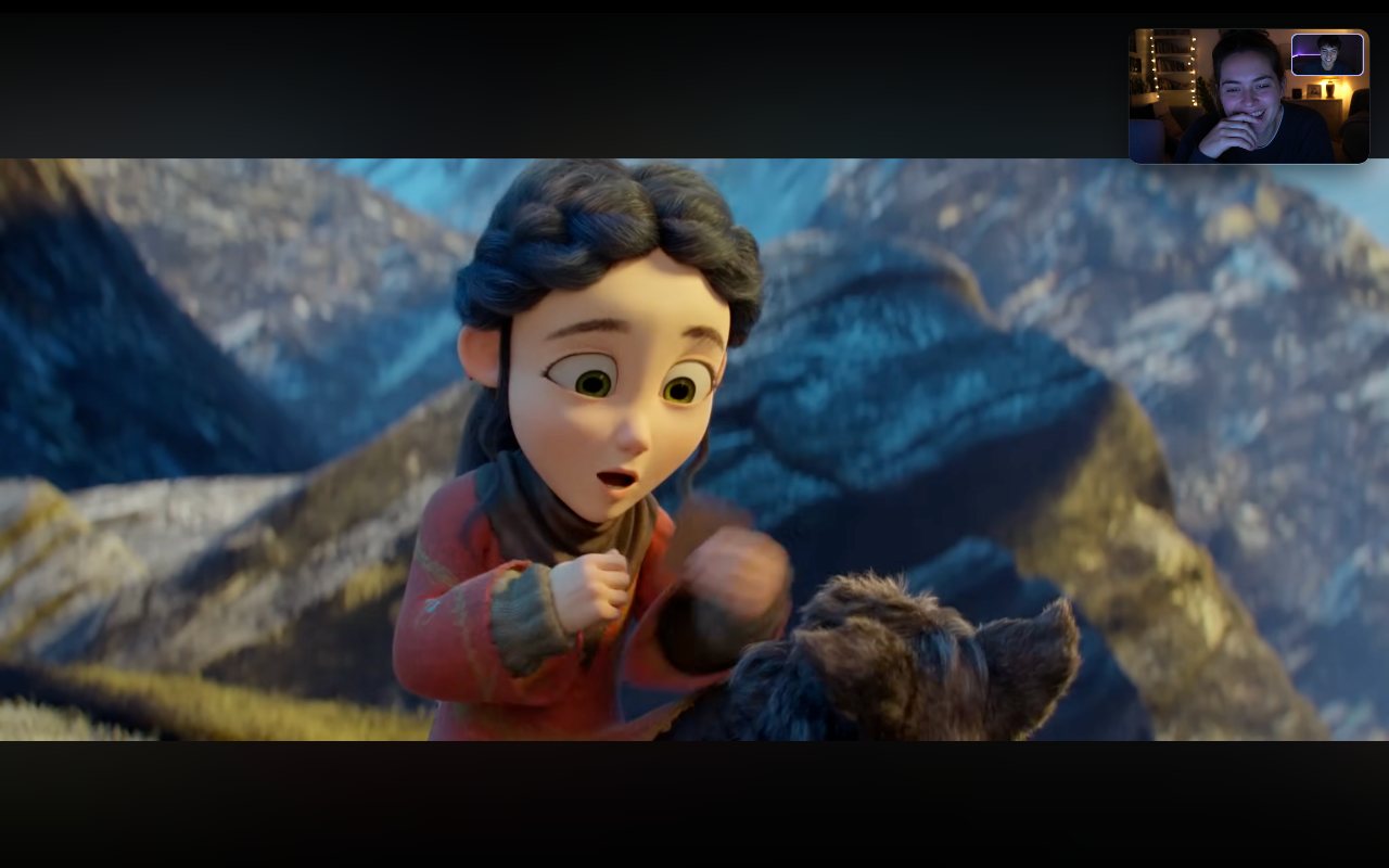A movie in fullscreen with a small NightIn video call window in the corner